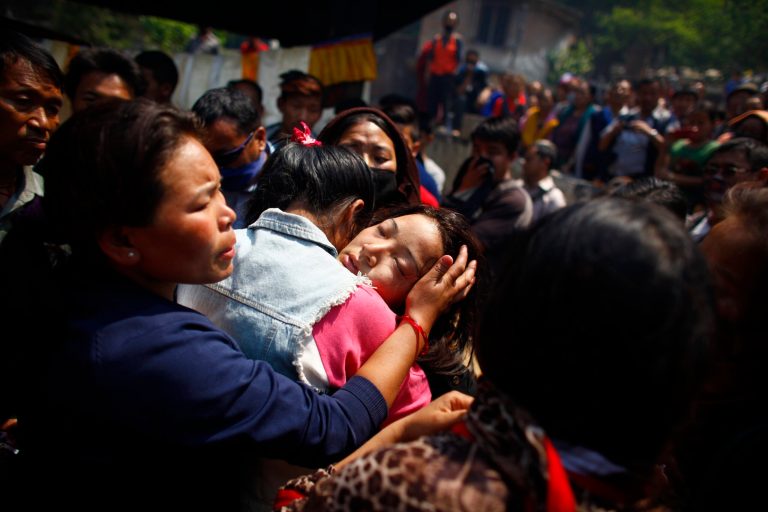 Daughter of Nepalese mountaineer Ang Kaji Sherpa, killed in an avalanche on Mount Everest, cries during the funeral ceremony in Katmandu, Nepal, Monday, April 21, 2014. Buddhist monks cremated the remains of Sherpa guides who were buried in the deadliest avalanche ever recorded on Mount Everest, a disaster that has prompted calls for a climbing boycott by Nepal's ethnic Sherpa community. The avalanche killed at least 13 Sherpas. Three other Sherpas remain missing and are presumed dead. (AP Photo/Niranjan Shrestha)