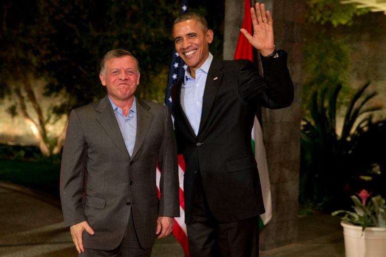 President Obama waves to the media as he greets Jordan's King Abdullah II at a retreat in Rancho Mirage, Calif., on Friday. (AP Photo/Jacquelyn Martin)