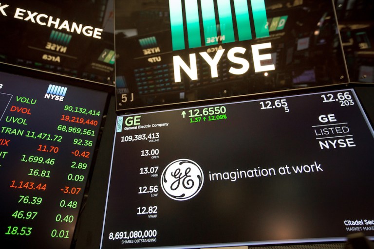 A monitor displays General Electric Co. signage on the floor of the New York Stock Exchange (NYSE) in New York, U.S., on Monday, Oct. 1, 2018. U.S. stocks rose toward records, while the Canadian dollar and Mexican peso gained after negotiatorsÂ agreedÂ to a new version of the Nafta trade pact. 