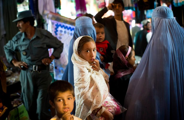   In this Oct. 23, 2012 photo, a young Afghan girl shops with her mother in a crowded bazaar in the heart of Lashkar Gah, southern Helmandâs provincial capital. After 11 years of war residents of southern Helmand, one of the deadliest battlefields, are frustrated by the lack of development and widespread insecurity. The International community is also increasingly worried that the gains made by women after the collapse of the Taliban are slowly slipping away. In deeply conservative Helmand women have worn the all encompassing burqas for centuries yet they too say the increasing insecurity makes them afraid even from behind their veils and shopkeepers say burqa sales are up. (AP Photo/Anja Niedringhaus)  