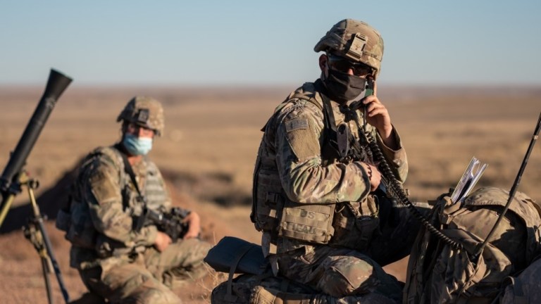 Sgt. Alexander Villafane, an Indirect Fire Infantryman assigned to the 1st Stryker Brigade Combat Team monitors the radio for fire commands as part of mortar qualification at Fort Carson, Colorado, November 16, 2020.
