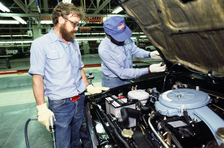 Workers at the new Nissan plant in Smyrna, Tenn., work on the assembly line in May 1983. (AP Photo)