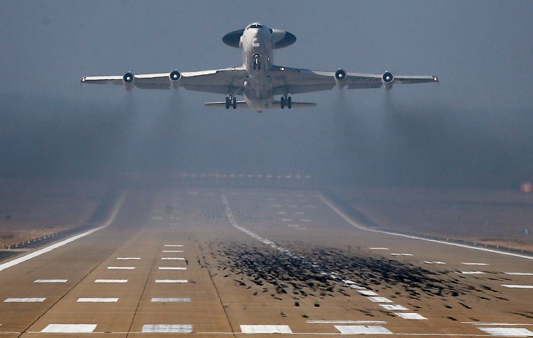 FILE - In this Wednesday, March 12, 2014 file photo, A NATO AWACS plane takes off the NATO Airbase in Geilenkirchen, Germany. Russia's readiness to use military force in Ukraine has been a wake-up call for many European countries, which since the Iron Curtain crumbled have slashed defense spending. Some shifted their priorities toward international missions in Afghanistan and elsewhere rather than deterring potential aggression from the East. Now, a serious recalibration is underway, particularly in countries with memories of Soviet tanks rumbling across their borders. (AP Photo/Frank Augstein, File)