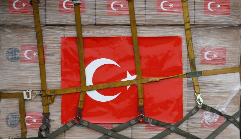 The Turkish flag is seen on a donation of medical supplies from Turkey as it is unloaded from a military aircraft, Tuesday, April 28, 2020, at Andrews Air Force Base, Md. The donation to help fight the new coronavirus in the United States included surgical masks, sanitizers and protective suits.