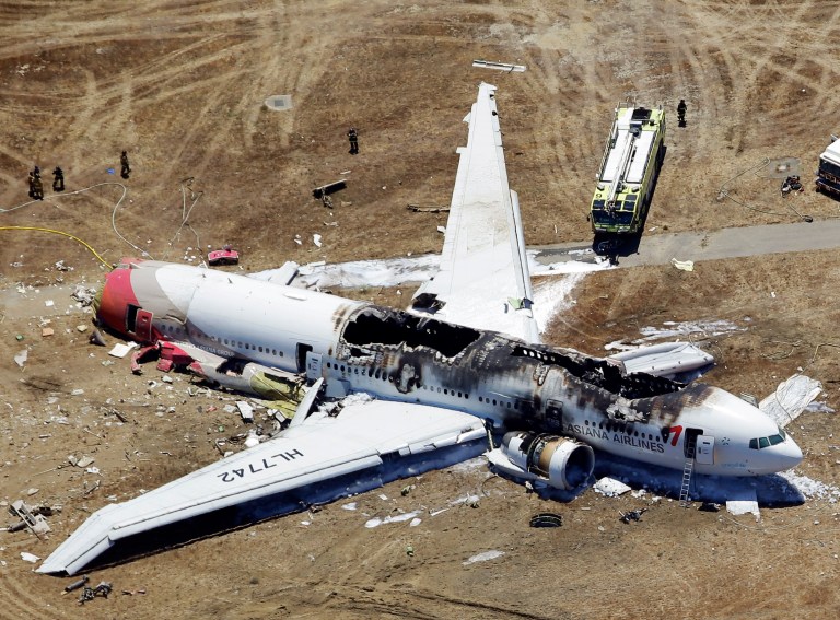 This aerial photo shows the wreckage of the Asiana Flight 214 airplane after it crashed at the San Francisco International Airport in San Francisco, Saturday,  July 6, 2013. (AP Photo/Marcio Jose Sanchez)