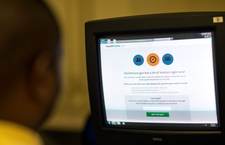 In a new budget outlook released Monday, the Congressional Budget Office said 13 million people are expected to buy plans through the Affordable Care Act's exchanges this year (AP Photo/David Goldman)