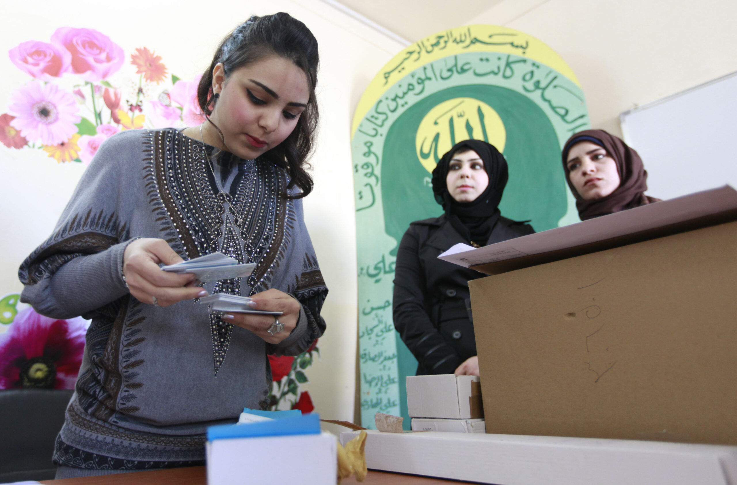 As Iraq hands out election IDs, unrest rages on