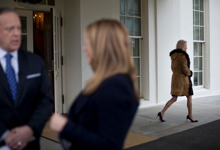 Counselor to the President Kellyanne Conway, right, walks out of the West Wing of the White House in Washington for a media interview while White House Press secretary Sean Spicer, left, also speaks to a member of the media, Monday, March 6, 2017. (AP Photo/Pablo Martinez Monsivais)
