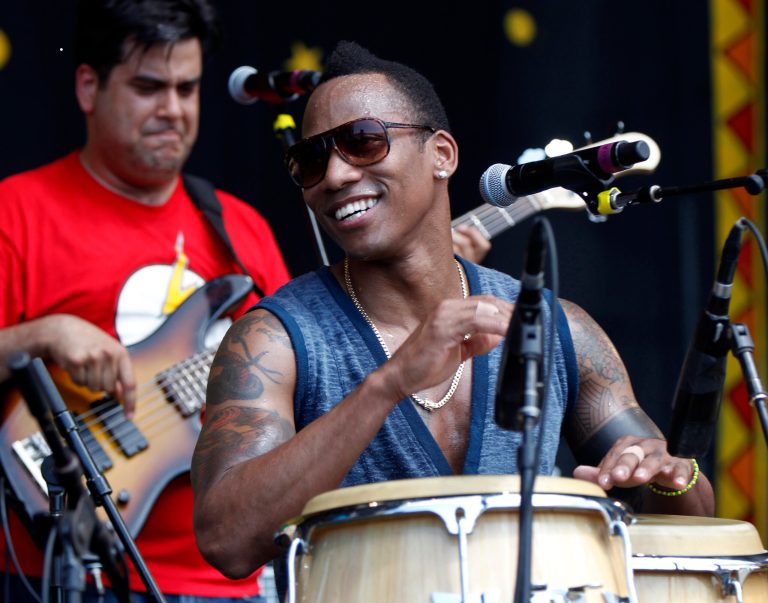FILE - In this May 4, 2012 file photo, the Pedrito Martinez Group performs at the New Orleans Jazz and Heritage Festival in New Orleans. Martinez and the Red Baraat rhythms band are among the acts heading to New Orleans to headline a festival celebrating the music and culture rooted in Africa that made its way to the Caribbean and Gulf South region centuries ago. The Congo Square New World Rhythms Festival is a free event open to the general public. It is in its sixth year and will be held at Armstrong Park in New Orleans March 23, 2013 through March 24. (AP Photo/Gerald Herbert, File)