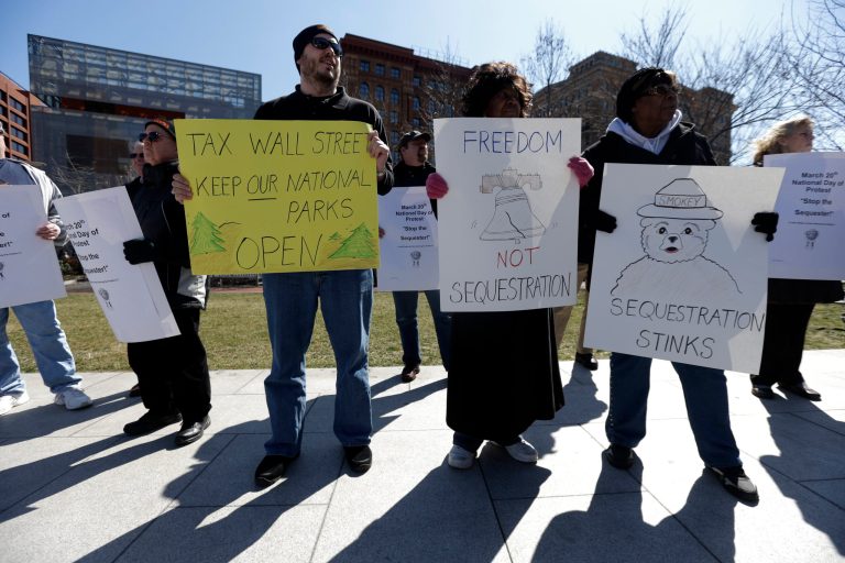 Government workers, supporting union members and activists protest against the across-the-board federal spending cuts called sequestration. Ending the across-the-board spending cuts mandated by the 2011 congressional debt ceiling deal would increase employment by nearly 1 million jobs by next year. (AP/Matt Rourke)