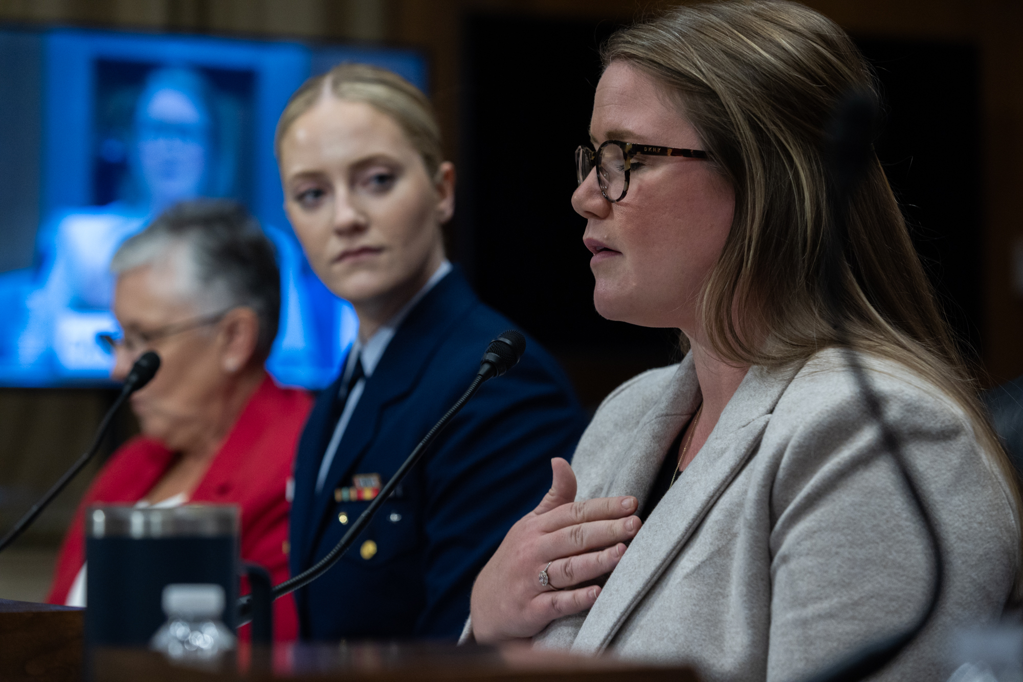 Former member of the Coast Guard Academy (class of 2008) Caitlin Maro testifies as First Class Cadet Kyra Holmstrup of the Coast Guard Academy (class of 2024) listens during a Senate Homeland Security and Governmental Affairs Investigations Subcommittee hearing on sexual assault in the Coast Guard on Capitol Hill on Dec. 12, 2023.