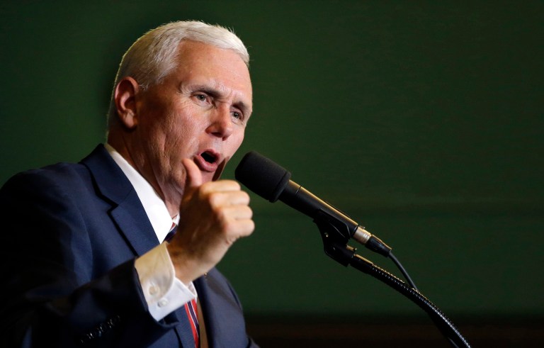 Republican vice presidential nominee Mike Pence bashed Hillary Clinton and her team at a rally on Friday evening for how it sought to play down the stories of the Americans killed in the 2012 attack in Benghazi. (AP Photo/Elise Amendola)