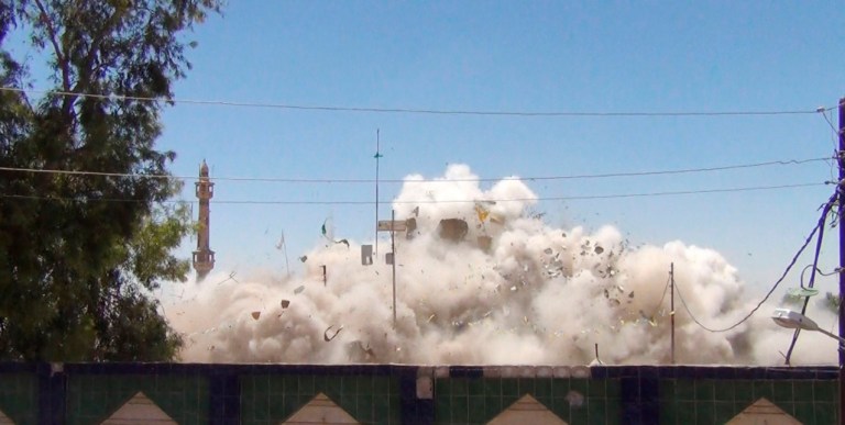 Smoke and debris go up in the air as Shiite's Saad bin Aqeel Husseiniya shrine explodes in Tal Afar, Iraq. (AP)