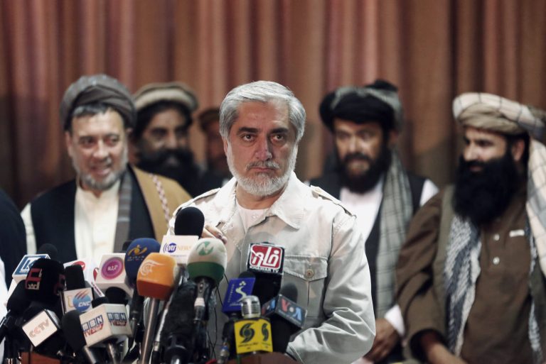 Afghanistan's presidential candidate Abdullah Abdullah, center, waits for journalists before a news conference in Kabul, Afghanistan, Thursday, June 19, 2014. Afghanistan's political crisis is showing no signs of easing as presidential candidate Abdullah said the electoral commission has ignored his demands and he will not resume cooperation with them. (AP Photo/Massoud Hossaini)