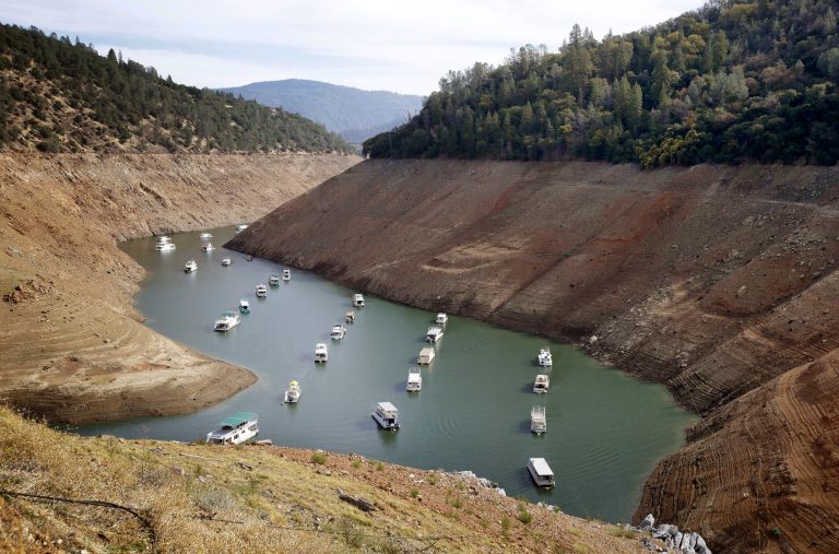 Houseboats float in the drought-lowered waters of Oroville Lake near Oroville, Calif., on Oct. 30, 2014. California might only receive 10 percent of expected supplies in 2016. (AP Photo)