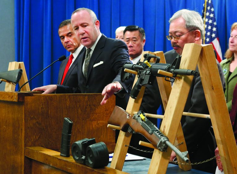 Senate President Pro Tem Darrell Steinberg, second from left, glances to a pair of semi-automatic rifles as he discusses a package of proposed gun control legislation at a Capitol news conference in Sacramento, Calif., Thursday, Feb. 7, 2013. Senate Democrats unveiled a package of 10 proposed laws designed to close loopholes in existing gun regulations, keep firearms and ammunition out of the hands of dangerous person and strengthen education relating to firearms and gun ownership. Also seen are Los Angeles Mayor Antonio Villaraigosa, left, Sen. Leland Yee, D-San Francisco, third from left, San Francisco Mayor Ed Lee, second from right. (AP Photo/Rich Pedroncelli)