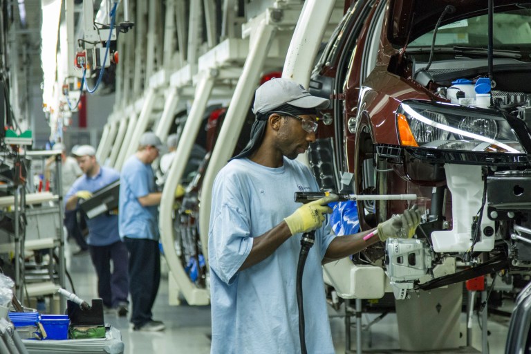 Workers assemble Volkswagen Passat sedans at the German automaker's plant in Chattanooga, Tenn., in this June 12, 2013, photo. (AP Photo/Erik Schelzig)
