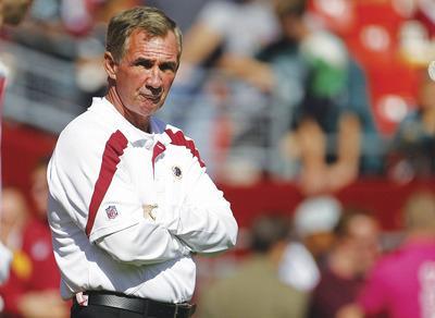 Evan Vucci/AP
Mike Shanahan has missed on his first two quarterbacks with the Redskins--Donovan McNabb and now Rex Grossman.