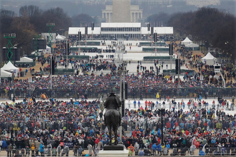 Crowds fill in along the National Mall before the swearing in of Donald Trump as the 45th president of the Untied States during the 58th Presidential Inauguration at the U.S. Capitol in Washington. Friday, Jan. 20, 2017. (AP Photo/Patrick Semansky)