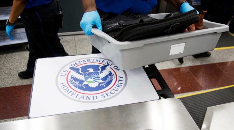 The video says that a TSA officer will press a button designating a gender 