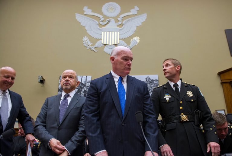 Secret Service Director Joseph Clancy, center, and other law enforcement officials arrive on Capitol Hill in Washington, Wednesday, April 29, 2015, to testify before a House Oversight and Government Reform Committee hearing on how a small gyrocopter entered restricted airspace and landed on the West Lawn of the Capitol. From left are, Deputy Assistant Defense Secretary Robert Salesses; FAA Administrator Michael Huerta; Clancy; and U.S. Park Police Chief Robert Maclean. (AP Photo/Cliff Owen)