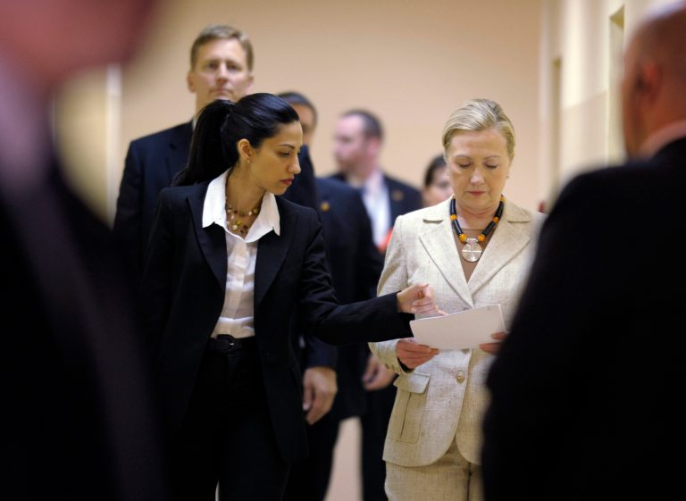 Huma Abedin, aide to Secretary of State Hillary Rodham, left, goes over notes with Clinton, during her visit to the newly opened University Teaching Hospital Pediatric Centre of Excellence, in Lusaka, Zambia, Saturday, June 11, 2011. (AP Photo/Susan Walsh, Pool)
