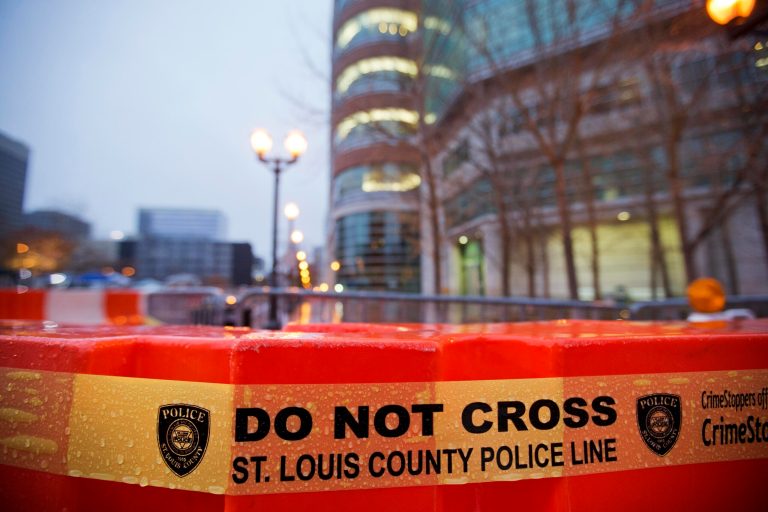 Barricades line the exterior of the Buzz Westfall Justice Center where a grand jury is expected to convene Monday to consider possible charges against the police officer who fatally shot Michael Brown in nearby Ferguson, in Clayton, Mo. Ferguson and the St. Louis region are on edge in anticipation of the announcement by a grand jury whether to criminally charge Officer Darren Wilson in the killing of 18-year-old Michael Brown. (AP Photo/David Goldman)