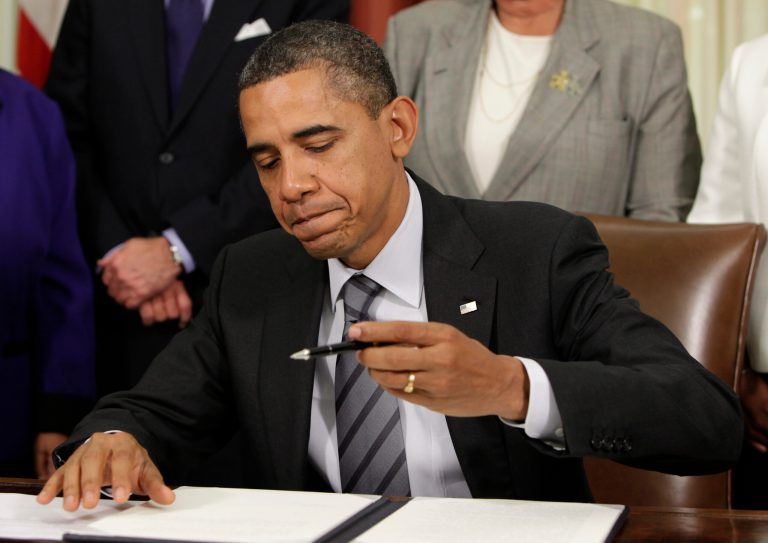 President Obama talks signs an Executive Order to cut waste and promote efficient spending across the federal government in the Oval Office at the White House on November 9, 2011 in Washingtons. (Photo by Yuri Gripas-Pool/Getty Images)