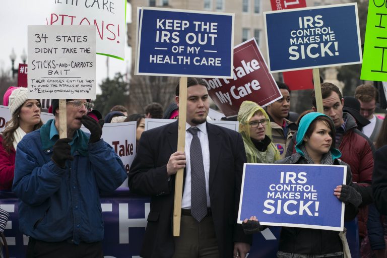 Demonstrators rally outside the Supreme Court in Washington, Wednesday, March 4, 2015, as the court heard arguments in the King v. Burwell case. (Graeme Jennings/Examiner File)