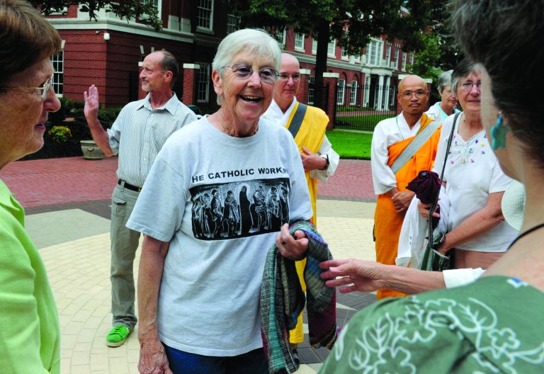 Y-12 protesters Sister Megan Rice, center, and Michael Walli, in the background waving, are greeted by supporters as they arrive for a federal court appearance Thursday, Aug. 9, 2012 in Knoxville, Tenn. Along with a third defendant third, Greg Boertje-Obed, the pair were indicted on charges stemming from their alleged July 2 infiltration of the Y-12 nuclear weapons plant in Oak Ridge, Tenn. (AP Photo/Knoxville News Sentinel, Michael Patrick)