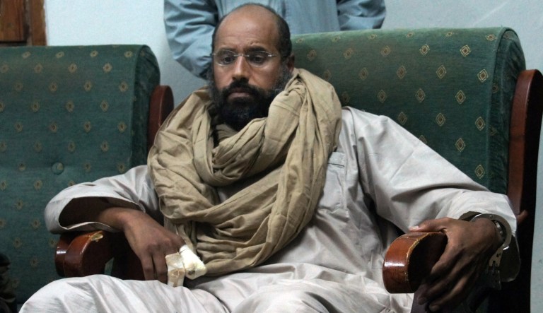 In this Saturday, Nov. 19, 2011 file photo, Seif al-Islam is seen after his capture in the custody of revolutionary fighters in Zintan, Libya. (AP Photo/Ammar El-Darwish, File)
