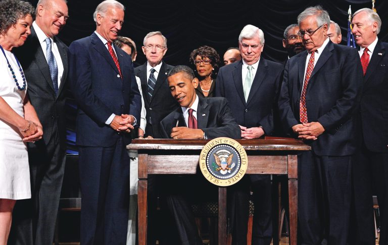 President Obama signs the the financial reform bill into law during a ceremony on July 21, 2010, in Washington. (Photo by Chip Somodevilla/Getty Images)