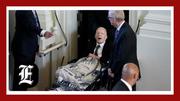 Jimmy Carter emerges from hospice to pay tribute draped in blanket with Rosalynn’s image