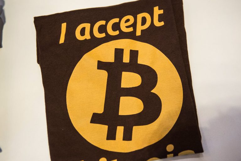 Shirts for sale are shown at the entrance of the Bitcoin Center NYC during a class on the basics of Bitcoin and how to trade the digital currency on February 26, 2014 in New York City.  (Photo by Andrew Burton/Getty Images)