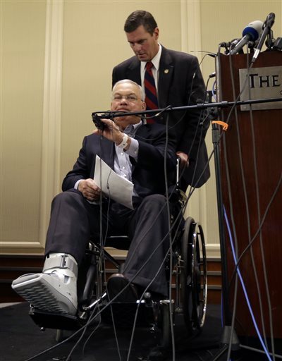 Boston Mayor Thomas Menino, below, is wheeled up to a microphone to speak during a news conference in Boston Tuesday, April 16, 2013, regarding two bombs which exploded in the street near the finish line of the Boston Marathon on Monday, killing at least  three people and injuring more than 170. (AP Photo/Elise Amendola)