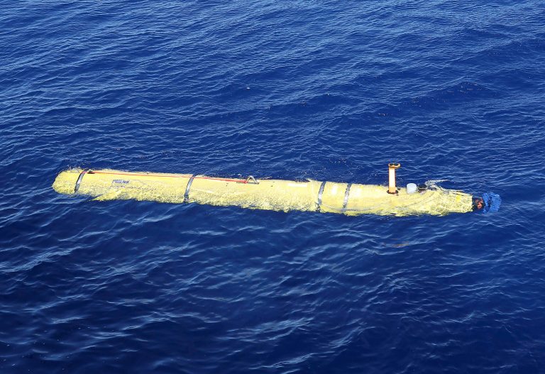In this Thursday, April 17, 2014 photo provided by the Australian Defense Force, the Phoenix International Autonomous Underwater Vehicle (AUV) Artemis is launched from the Australian Defense Vessel Ocean Shield in to the southern Indian Ocean in the search of the missing Malaysia Airlines Flight 370. Up to 11 aircraft and 12 ships continue to scan the ocean surface for debris from the Boeing 777 that disappeared March 8 en route from Kuala Lumpur to Beijing with 239 people on board. (AP Photo/Australian Defense Force, Bradley Darvill) EDITORIAL USE ONLY