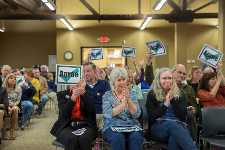 Audience members react as a woman expresses anguish about proposed cuts to Medicaid during a town hall hosted by U.S. Rep. James Comer, R-Ky., on March 24 at the Commerce Center Community Room in Paducah, Ky. (Ryan Hermens/The Paducah Sun via AP)