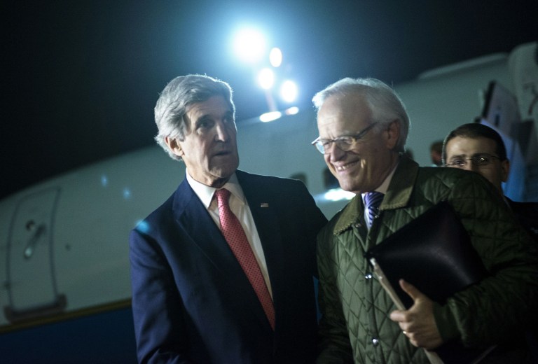 US Secretary of State John Kerry, left, walks with US Special Envoy for Israeli-Palestinian Negotiations Martin Indyk, right, while returning from a trip to Jordan and Saudi Arabia, at Ben Gurion International Airport, Tel Aviv Israel, on Sunday Jan. 5. (AP Photo / Brendan Smialowski, Pool)