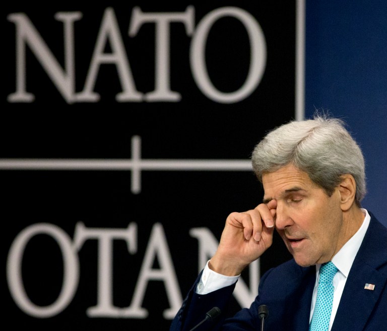 U.S. Secretary of State John Kerry pauses before speaking during a media conference at NATO headquarters in Brussels on Wednesday, Dec. 2, 2015. (AP Photo/Virginia Mayo)