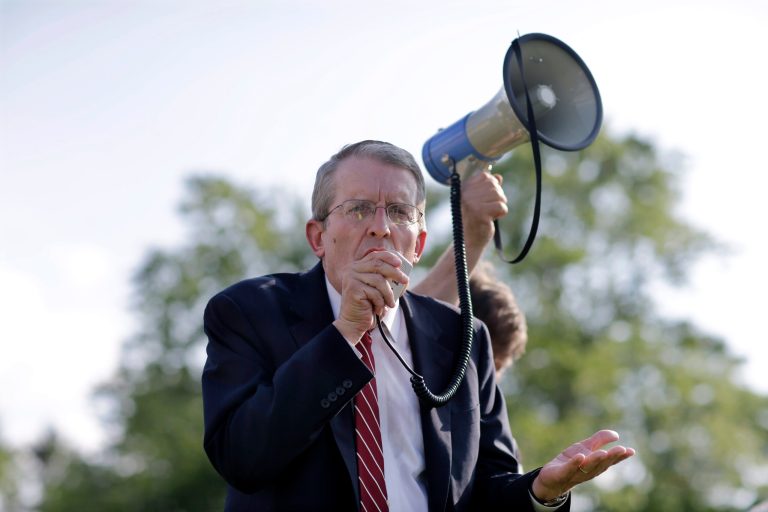 Republican Jeff Bell uses a bullhorn to address a gathering in Cherry Hill, N.J. (AP/Mel Evans)