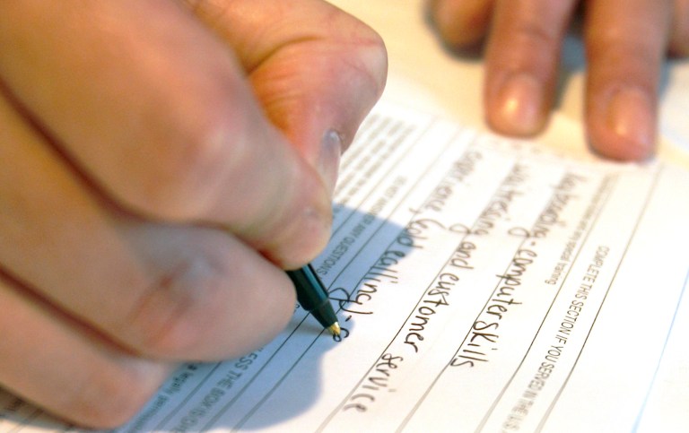 FILE - In this July 21, 2011 photo, Sonya Mosey from Altoona, Pa. fills out an employment application for Gillece Services at the Pittsburgh Career Fair, in Pittsburgh. The U.S. Labor Department on Thursday, Oct. 16, 2014 reports on the number of people who applied for unemployment benefits for the week ending Oct. 11, 2014. (AP Photo/Keith Srakocic, File)