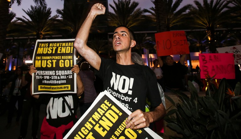 Protesters gather outside of California Republican Convention in Anaheim, Calf., where former White House adviser Steve Bannon is expected to give the keynote speech. (AP Photo/Ringo H.W. Chiu)