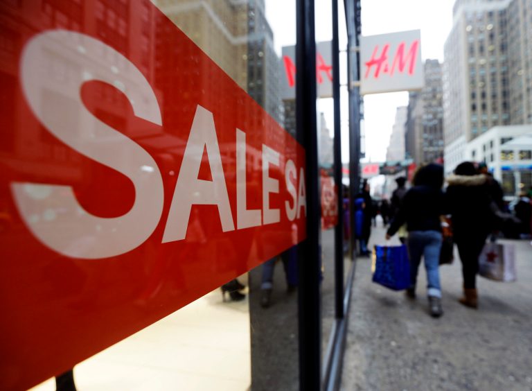   Shoppers walk past an H&M location, Wednesday, Dec. 26, 2012, in New York. This holiday season is shaping up to be the weakest since the country was in the middle of a deep recession in 2008. That not only shows that stores misread Americans' willingness to spend during this period of economic uncertainty. It also could indicate that the days of throngs of shoppers spending thousands of dollars willy nilly on holiday gifts may be long gone. (AP Photo/Frank Franklin II)  