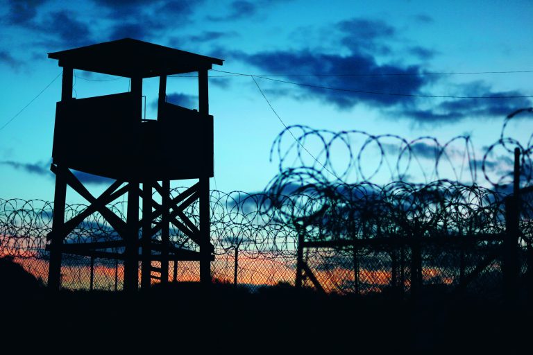 GUANTANAMO BAY, CUBA - JUNE 27:  (EDITORS NOTE: Image has been reviewed by the U.S. Military prior to transmission.) A watch tower is seen in the currently closed Camp X-Ray which was the first detention facility to hold 'enemy combatants' at the U.S. Naval Station on June 27, 2013 in Guantanamo Bay, Cuba.The U.S. Naval Station at Guantanamo Bay, houses the American detention center for 'enemy combatants'. President Barack Obama has recently spoken again about closing the prison which has been used to hold prisoners from the invasion of Afghanistan and the war on terror since early 2002.  (Photo by Joe Raedle/Getty Images)