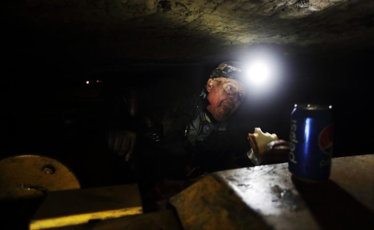 A bipartisan group of 22 senators pressed both House and Senate leaders on Tuesday to pass a bill to protect coal miners' pensions by the end of the year. (AP Photo/David Goldman)