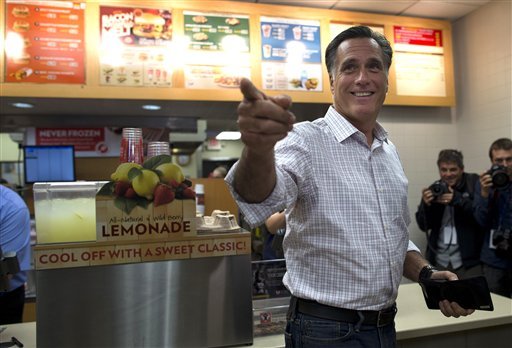 Republican presidential candidate, former Massachusetts Gov. Mitt Romney asks his staff for their orders after stopping at Wendy's on Tuesday, Oct. 9, 2012, in Cuyahoga Falls, Ohio.  (AP Photo/ Evan Vucci)