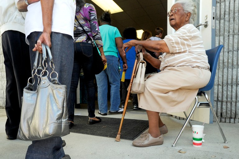 WILSON, NC - OCTOBER 18: People wait in line to vote at the Board of Elections early voting site on October 18, 2012 in Wilson, North Carolina. Today is the last day to register and the first day to vote for the election in North Carolina. (Photo by Sara D. Davis/Getty Images)