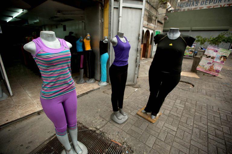 Mannequins stand at a store that sells clothing for over weight people in downtown Caracas, Venezuela, Tuesday, Aug. 26, 2014. The Venezuelan government has launched a public relations campaign to halt a steady rise in obesity that, if left unchecked, threatens to lead to a costly, public health crisis. (AP Photo/Fernando Llano)