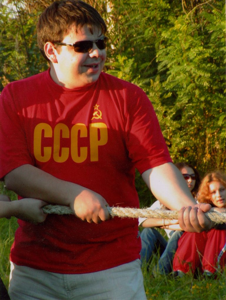   In this 2004 family handout photo provided by Maksym Shynkarenko's sister Vladislava Silanteyva, shows Maksym Shynkarenko, wearing a T-shirt reading USSR, photographed during a picnic with friends in Kiev, Ukarine. Shynkarenko, 33, from the eastern Ukrainian city of Kharkiv, has been charged in the United States with operating numerous Ukraine-based hardcore child porn sites and selling access to clients worldwide. Shynkarenko has pleaded innocent to the charges in a Newark federal court.(AP Photo/A family handout photo provided by Vladislava Silanteyva)  