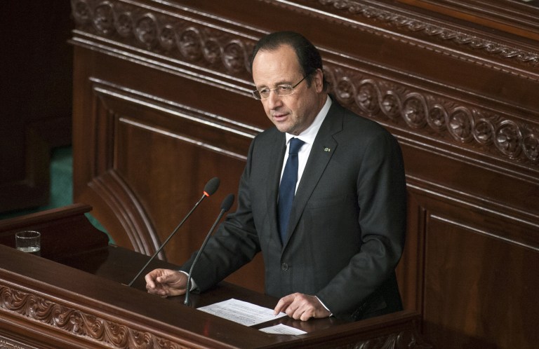 French President Francois Hollande delivers his speech at the Constituent Assembly in Tunis, Friday, Feb. 7, 2014. World leaders attended a ceremony for the formal adoption of a document being praised as one of the most progressive constitutions in an Arab nation. (AP Photo/Aimen Zine)